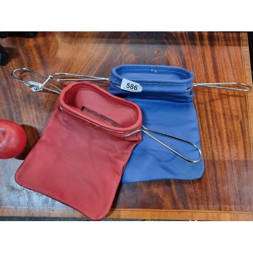 586 - Two vintage leather church collection bags in blue and red.