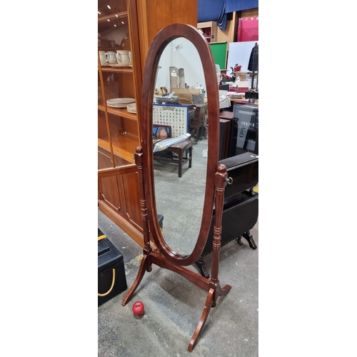 597 - A very attractive floor standing swing mirror.