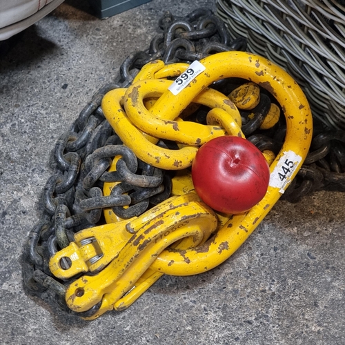 599 - A heavy duty industrial lifting winch hook and thick chain.