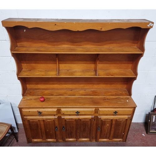 603 - Star Lot : A large very impressive pine kitchen dresser with plate racks, three drawers and three do... 