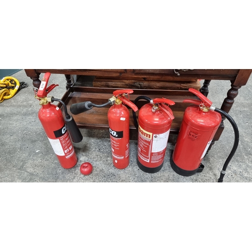 618 - A selection of four fire extinguishers including two 6 litre examples. Look newish and clean