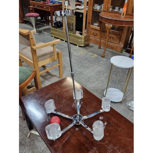 630 - A fabulous contemporary five branch chandelier with think glass holders and a heavy chrome finish. I... 