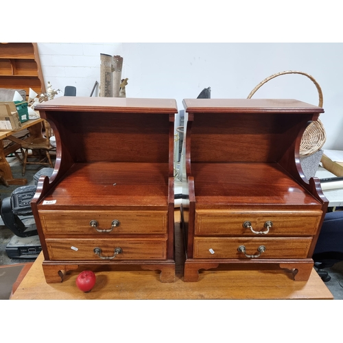 637 - A handsome pair of rosewood bedside locks featuring two pull out drawers to front and brass handles.