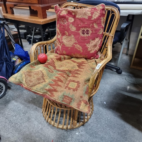 642 - A vintage mid century bamboo and rattan armchair. Includes two stylish cushions in red and gold tone... 