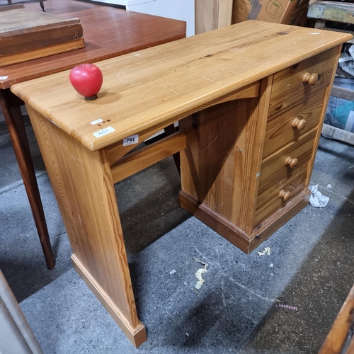 651 - A lovely pine wood desk with four drawers to side.