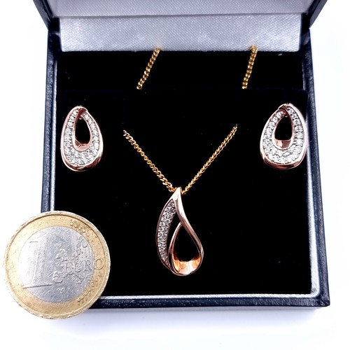 535 - A most attractive suite of rose gold toned jewellery consisting of a drop pendant with gem stone acc... 