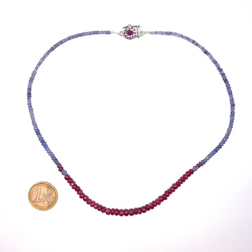 526 - An unusual graduated sapphire and ruby necklace set with a ruby sterling silver clasp, length 44cm, ... 