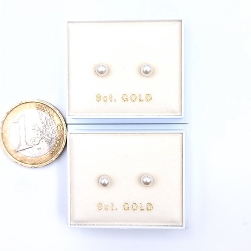 542 - Two pairs of 9K gold pearl stud earrings. Boxed.