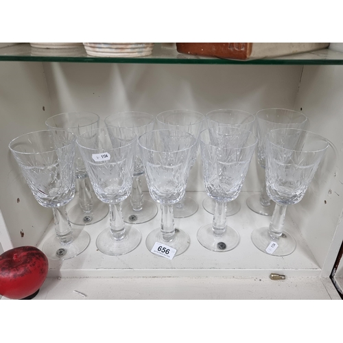 656 - A selection of 10 stemmed wine glasses with the Browne surname coat of arms etched to each.