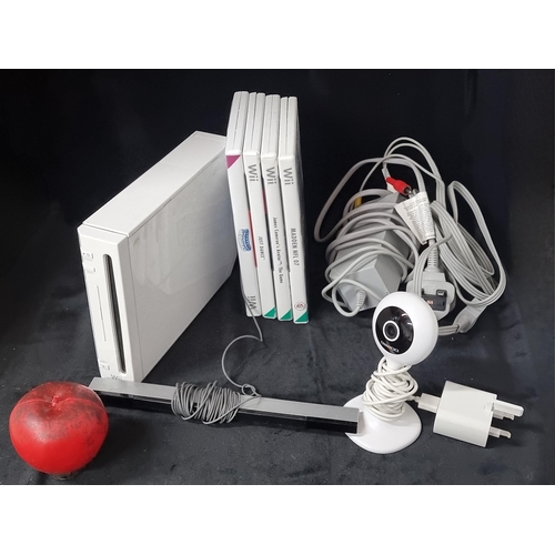 685 - A collection of gaming items including a Nintendo Wii console model RVL-001 and three Wii games incl... 