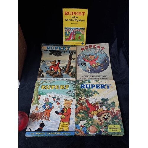 689 - A collection of 5 vintage 'Rupert' children's books including 'Rupert in the Wood of Mystery'. C. 19... 