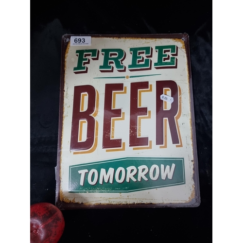 693 - A metal plaque with text in relief reading 'Free Beer Tomorrow'.