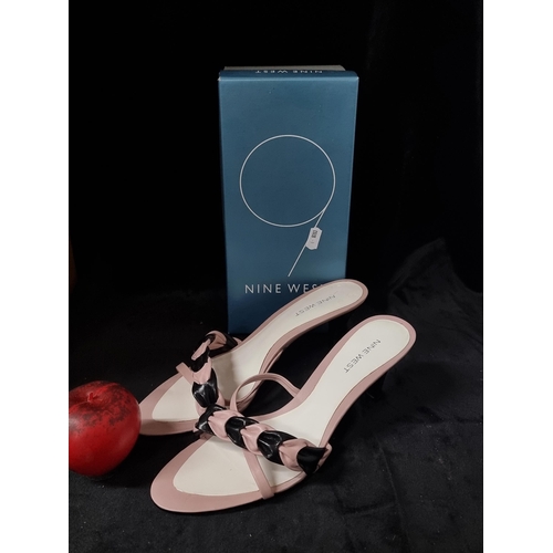 694 - A lovely pair of genuine leather new unworn Nine West kitten heel sandals with woven straps. In a ba... 