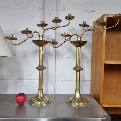 703 - Star Lot : A pair of stunning large antique heavy brass ecclesiastical candelabras with asymmetrical... 