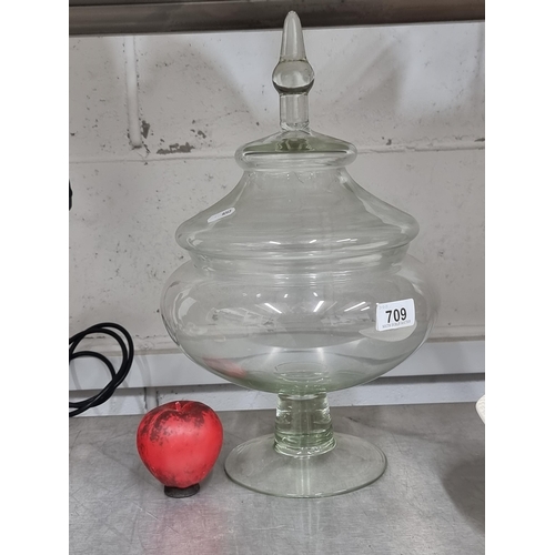 709 - A super glass large sweet jar with footed base and lid with finial.