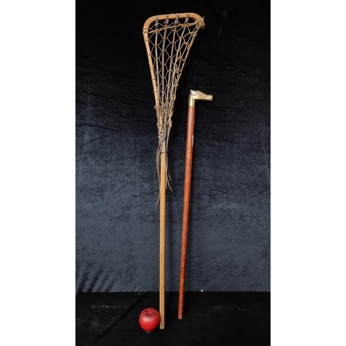 715 - A super vintage leather and gut string la crosse stick along with a a wood and brass horse head walk... 