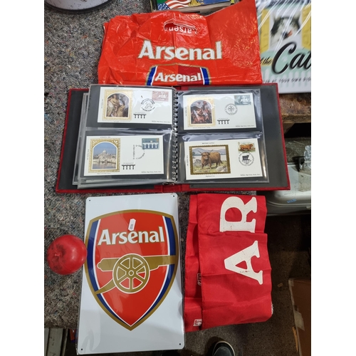 845 - Three Arsenal FC branded items including a silk scarf, plastic bag and a metal sign featuring the cl... 