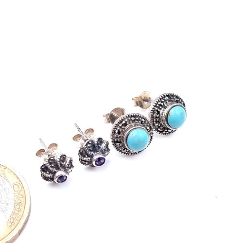 536 - Two pairs of vintage stud earrings consisting of a turquoise stone pair together with an amethyst st... 