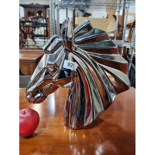 921 - Vibrant heavy chrome sculpture, capturing the dynamic essence of a horse's head with reflective eleg... 