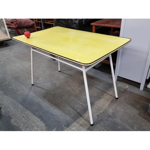 946 - A vibrant mid century retro dining table with a yellow top and white metal legs. Great looking piece... 