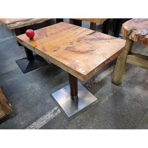 949 - Star lot A Heavy quality 4 person table featuring a  live-edge wood top and modern chrome base. A fa... 