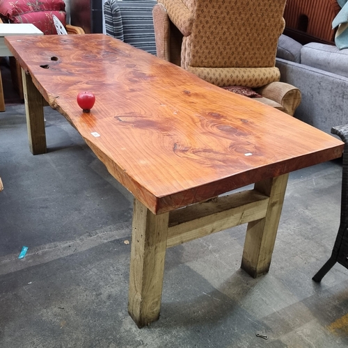 953 - A gorgeous extra long live-edge wood dining table held on wooden supports. Exuding rustic charm and ... 