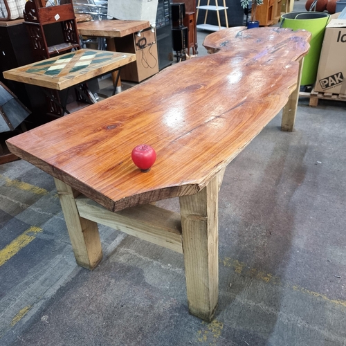 954 - Star lot : A very attractive long live-edge wood dining table held on wooden supports. Exuding warmt... 