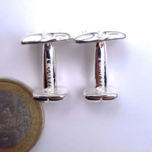 20 - A pair of diced designed sterling silver Tiffany & Co cuff links, total weight 11.26 grams, comes in... 