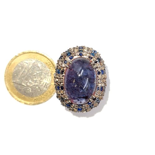 501 - Star Lot : A natural huge cabochon tazanite central stone 13.3 cts, weight of ring 8 grams, surround... 