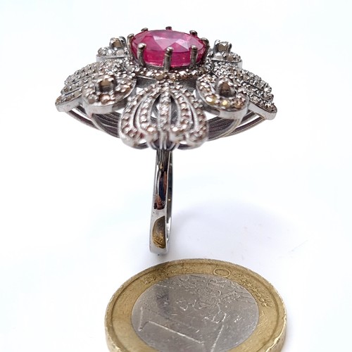 504 - Star Lot : A beautiful ruby ring mounted in ruby surrounded by diamonds, weight of ruby 4.1 cts, dia... 