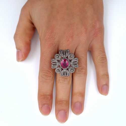 504 - Star Lot : A beautiful ruby ring mounted in ruby surrounded by diamonds, weight of ruby 4.1 cts, dia... 