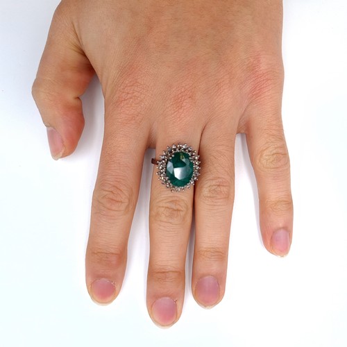 507 - Star Lot : A very fine emerald stone ring of 5.5 cts, with a diamond surround of 1 ct, ring mounted ... 