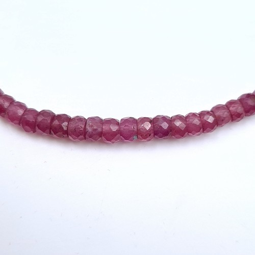 514 - A pretty ruby gemstone graduated necklace, set with am attractive sterling silver ruby stone set cla... 