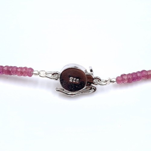 514 - A pretty ruby gemstone graduated necklace, set with am attractive sterling silver ruby stone set cla... 