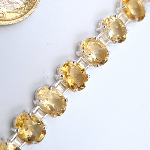 517 - A most attractive citrine stone line bracelet, consisting of 18 beautifully matched bright gemstones... 