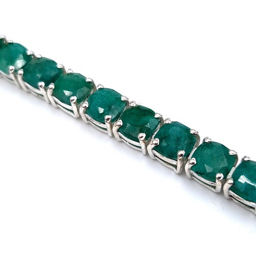 518 - Star lot : A very pretty beautifully matched natural Emerald mounted 26 stone line bracelet, weight ... 