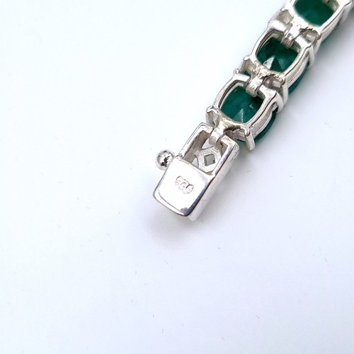 518 - Star lot : A very pretty beautifully matched natural Emerald mounted 26 stone line bracelet, weight ... 