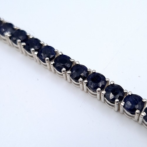 520 - Star lot : A fabulous 34 stone beautifully matched sapphire line bracelet, weight 17.52 grams. All s... 