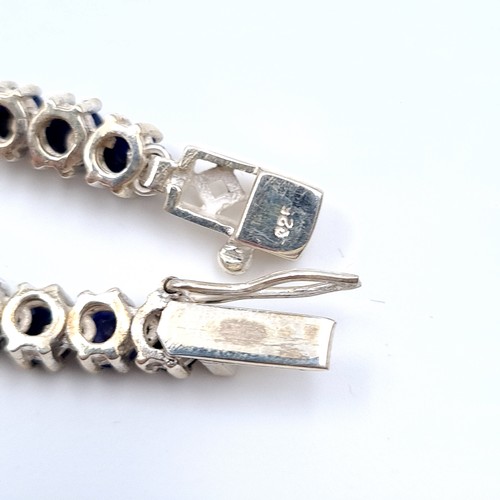 524 - Star Lot : A very nice example of a long sapphire stone necklace set in sterling silver, length of n... 