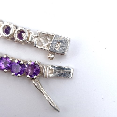 525 - A very nice example of a bright stoned amethyst necklace set in sterling silver, length 46cm, weight... 