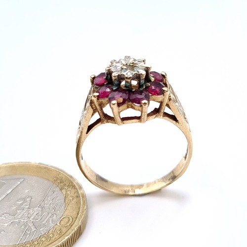 529 - Star Lot : A good quality vintage hallmarked 9K gold vintage diamond and ruby ring, stones set to a ... 