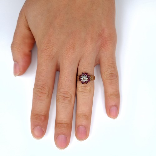 529 - Star Lot : A good quality vintage hallmarked 9K gold vintage diamond and ruby ring, stones set to a ... 