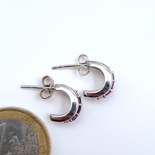 530 - Star Lot : A very fine pair of 9K white gold stud earrings (marked to posts), set with amethyst and ... 