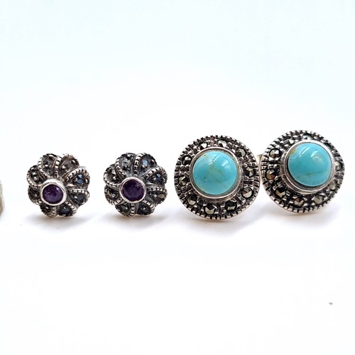 536 - Two pairs of vintage stud earrings consisting of a turquoise stone pair together with an amethyst st... 