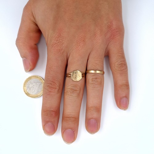 540 - Two 9K gold rings and eagle mounted signet ring together with a band ring, sizes K and L, total weig... 