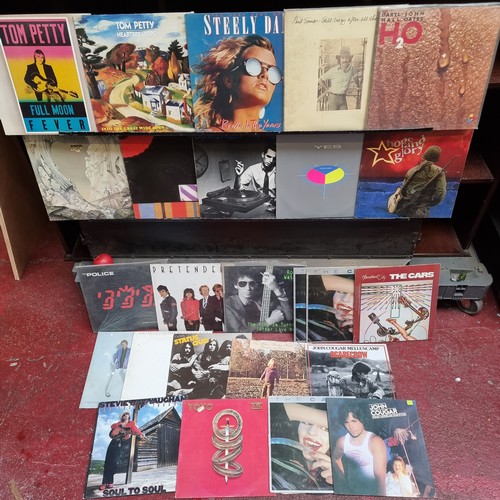 155 - A collection of 26 LP vinyl records including Tom Petty, Steely Dan and Paul Simon.