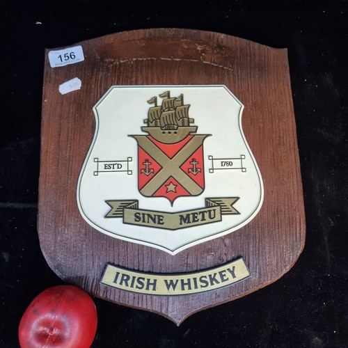 156 - A wooden wall plaque featuring the Jameson Irish whiskey crest to centre. Missing 'Jameson' plaque t... 