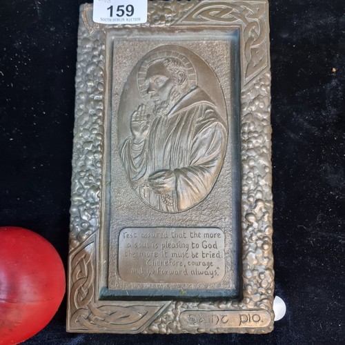 159 - A cast metal wall plaque featuring Saint Pio with a quote to base. Features interlaced design to bor... 