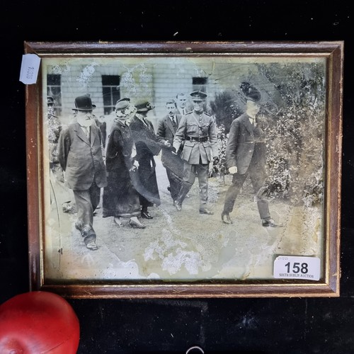 158 - An early 20th century original photograph featuring membesrs of the Irish Govt and women shaking the... 