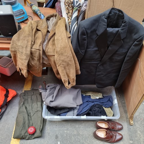 452 - A large crate containing a variety of mens clothing items including a two piece suit, suit trousers,... 